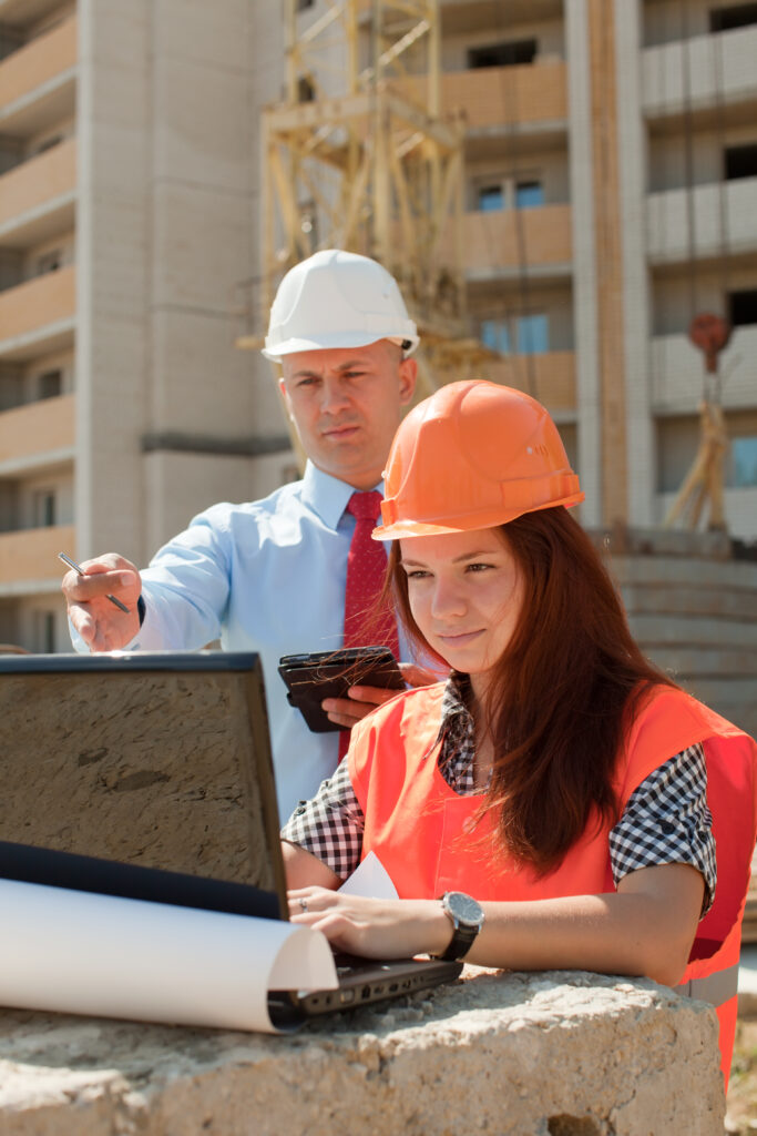 white collar workers works on the building site